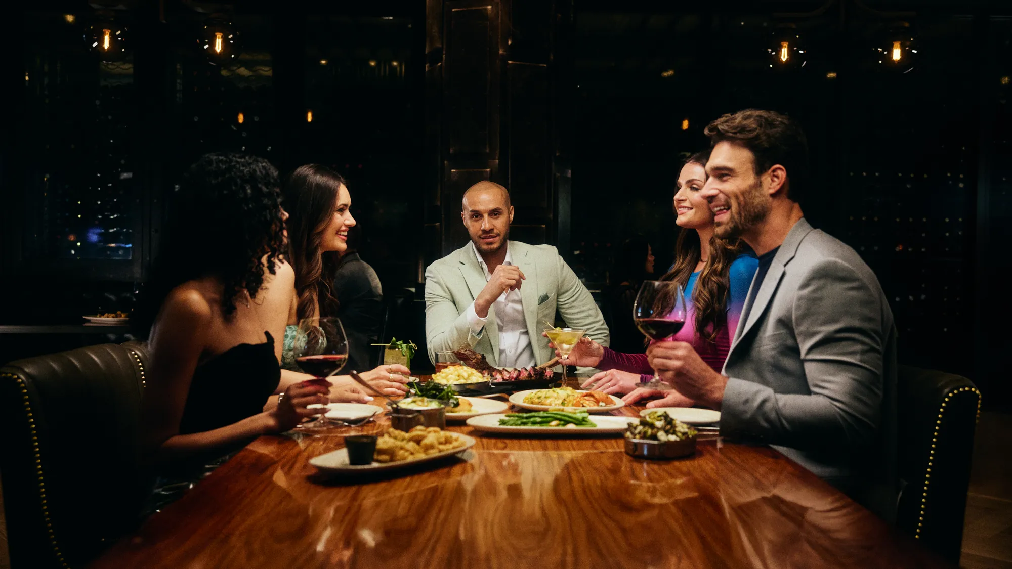 A group of friends enjoying dinner at Ocean Steak