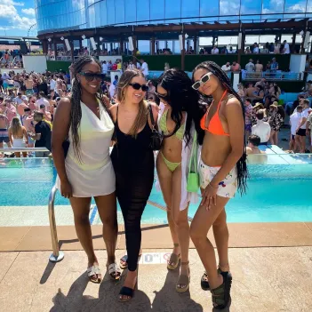 dom vlynn standing near the pool at HQ2 Beach Club